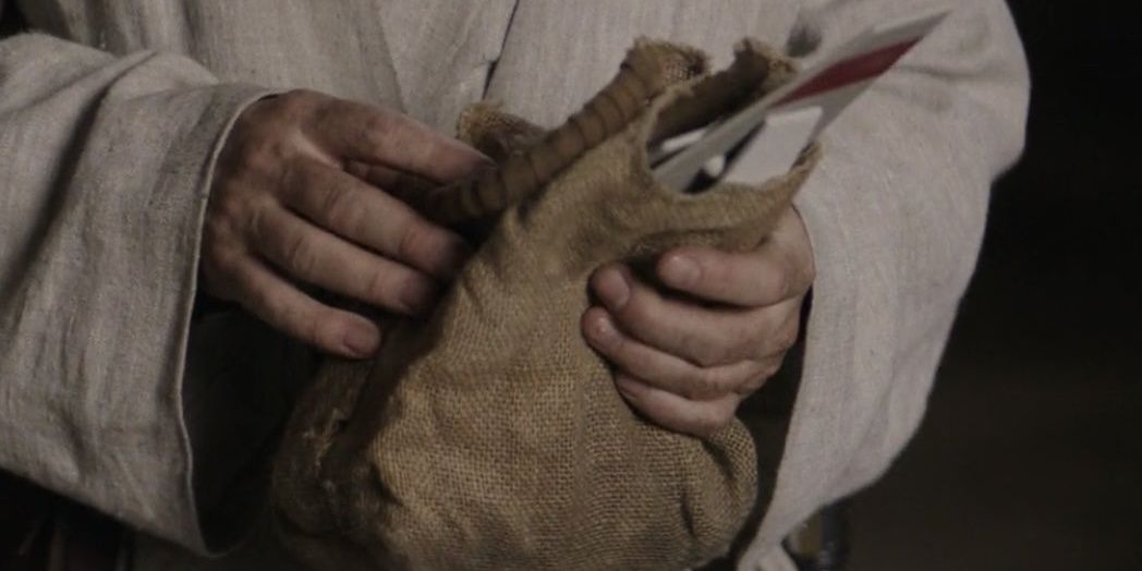 obi-wan holding a skyhopper toy