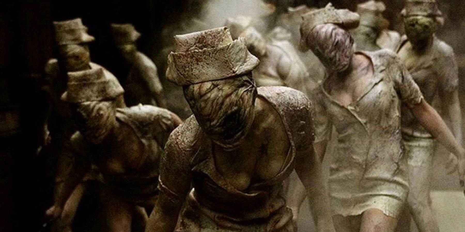 Image from the Silent Hill movie showing a group of nurses advancing.