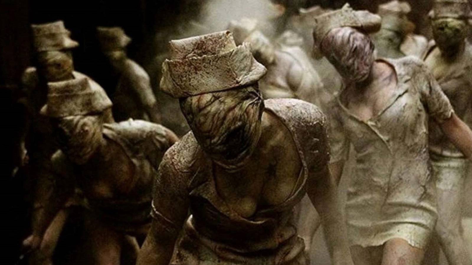 Image from the Silent Hill movie showing a group of nurses advancing.