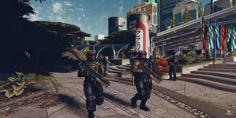 Characters with guns walking around a city