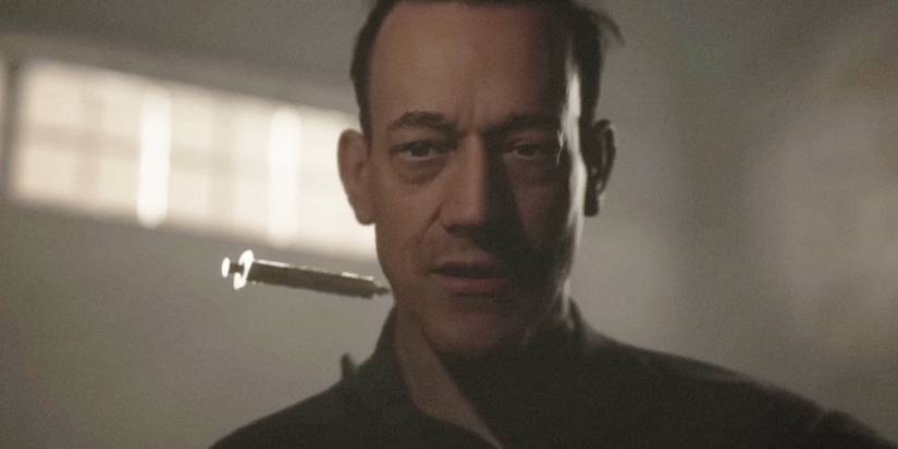 travis is injected with the syringe in the quarry