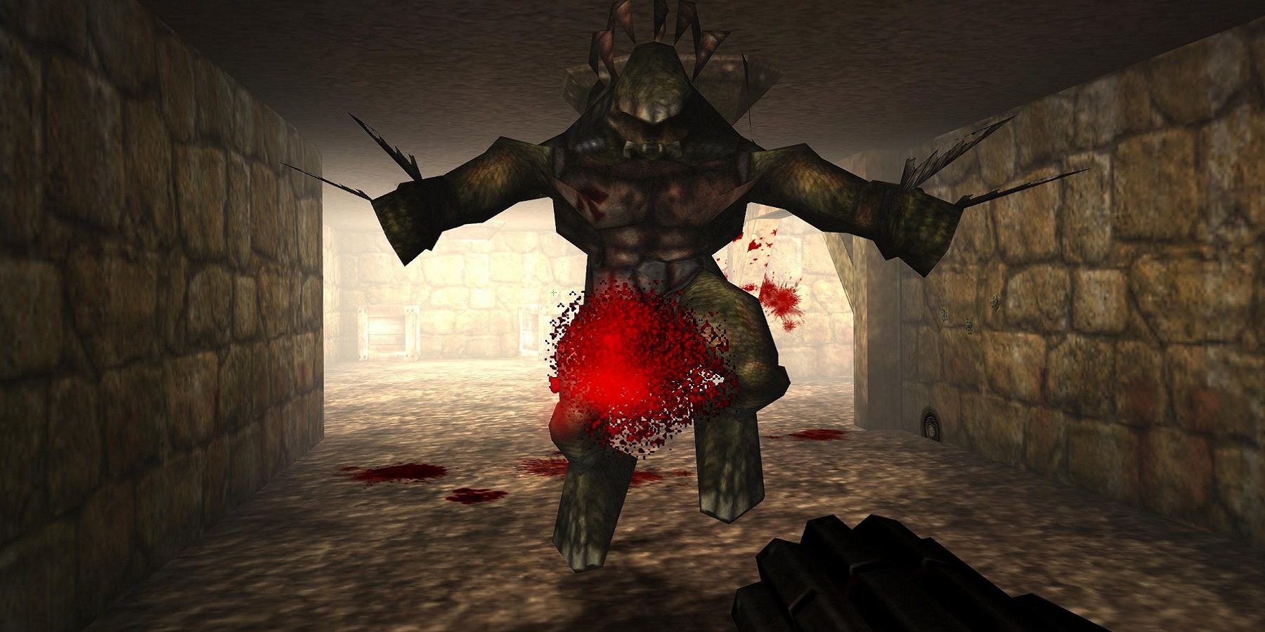 Image from the original 1998 Unreal game showing the player shooting a monster in a tunnel.
