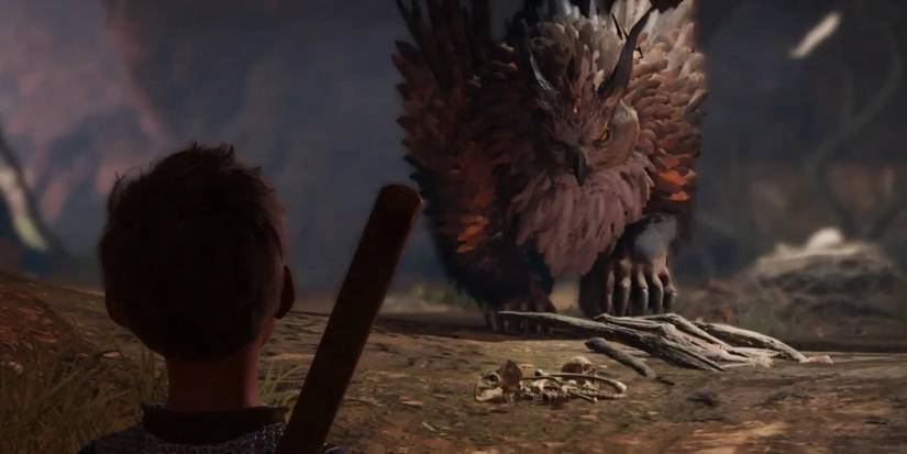 Over the shoulder shot of a player with a staff being approached by a large owlbear creature in Baldur's Gate 3