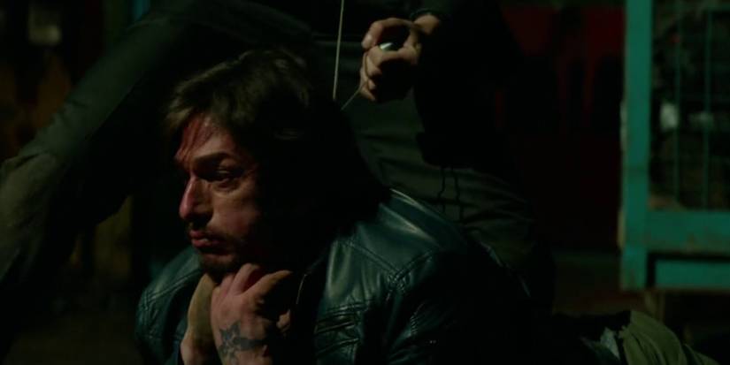 john using a wire to choke someone