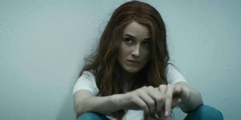 queen maeve sitting down in a cell