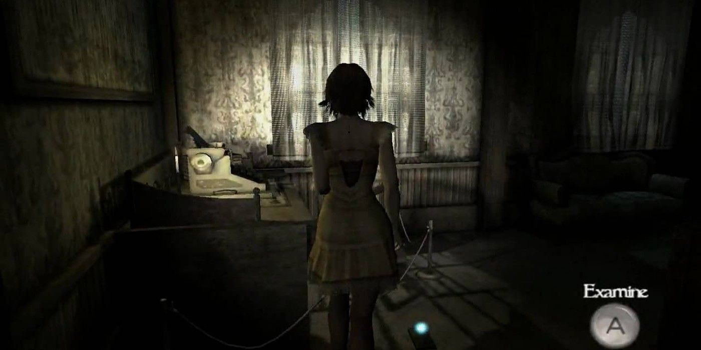 Girl shining flashlight in dark room with typewriter in Fatal Frame Mask Of The Lunar Eclipse Wii