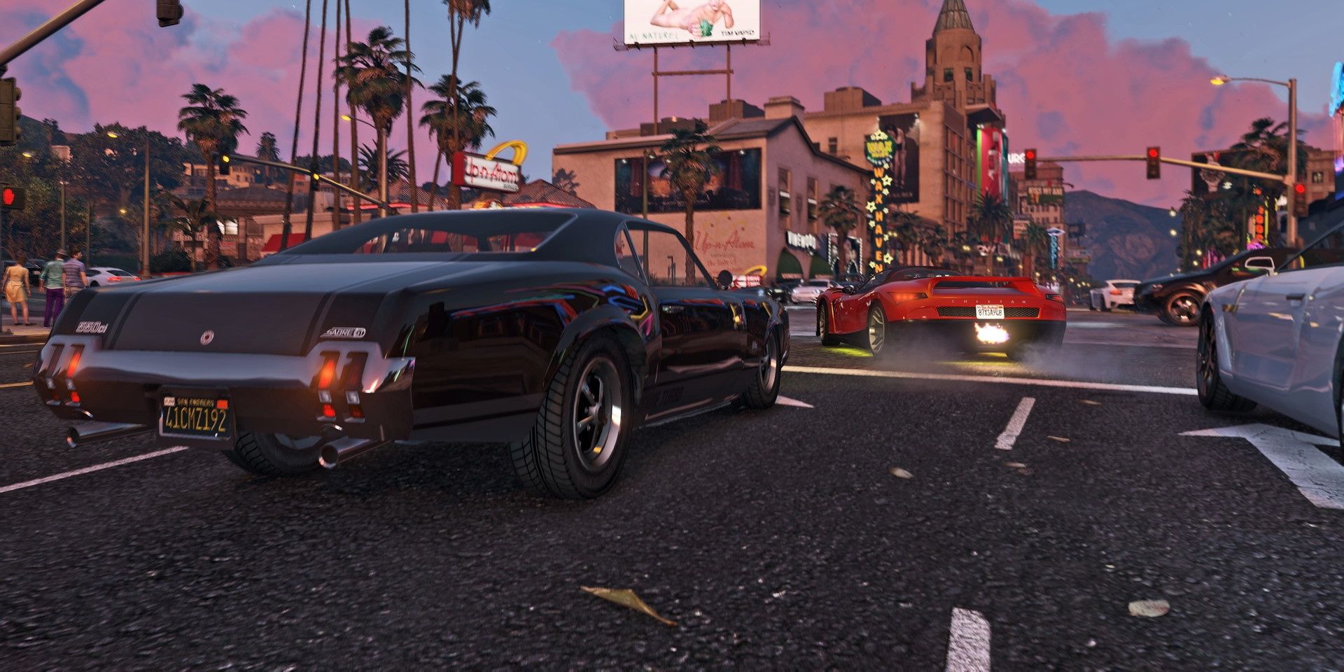 A handful of vehicles on the streets of Los Santos in GTA Online