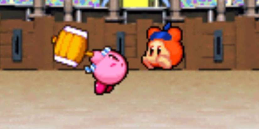 Kirby in the Arena in Super Star Ultra fighting a Waddle Dee with a mallet