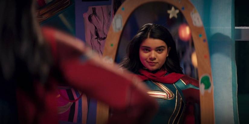 Ms. Marvel trying costume in mirror