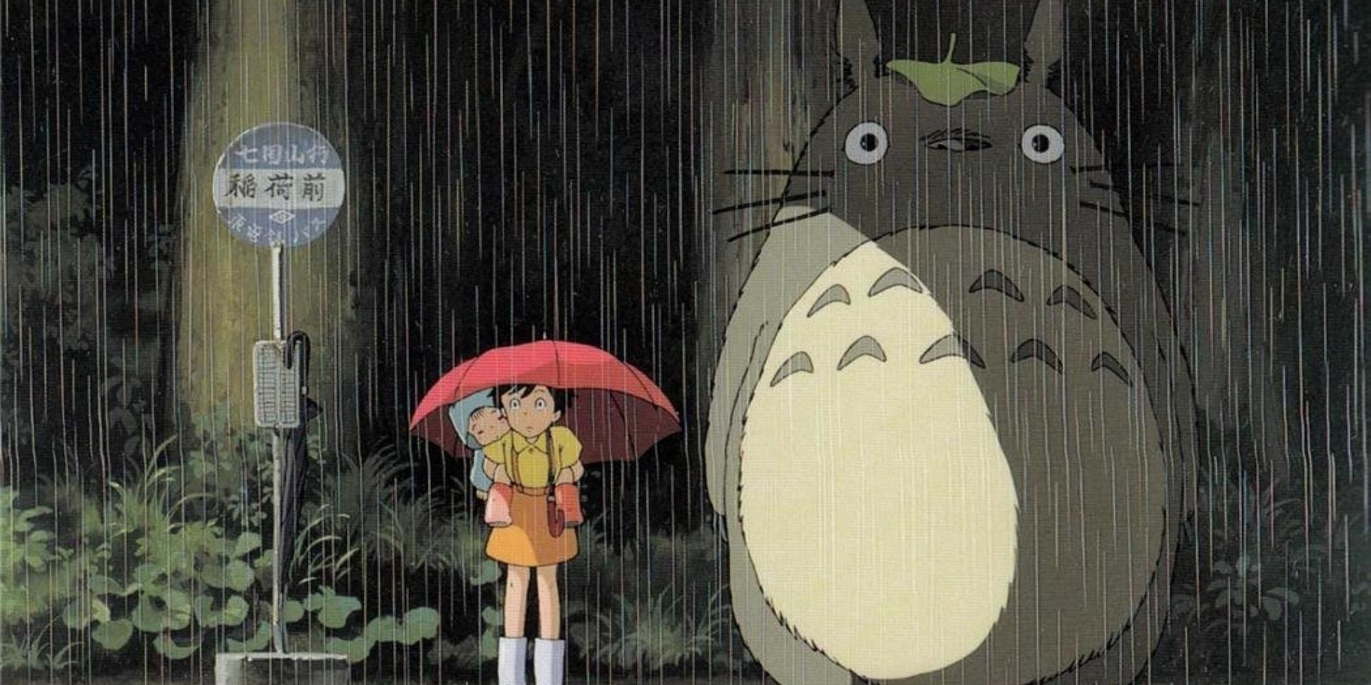 Satsuki, Mei, and Totoro waiting at the bus stop in My Neighbor Totoro