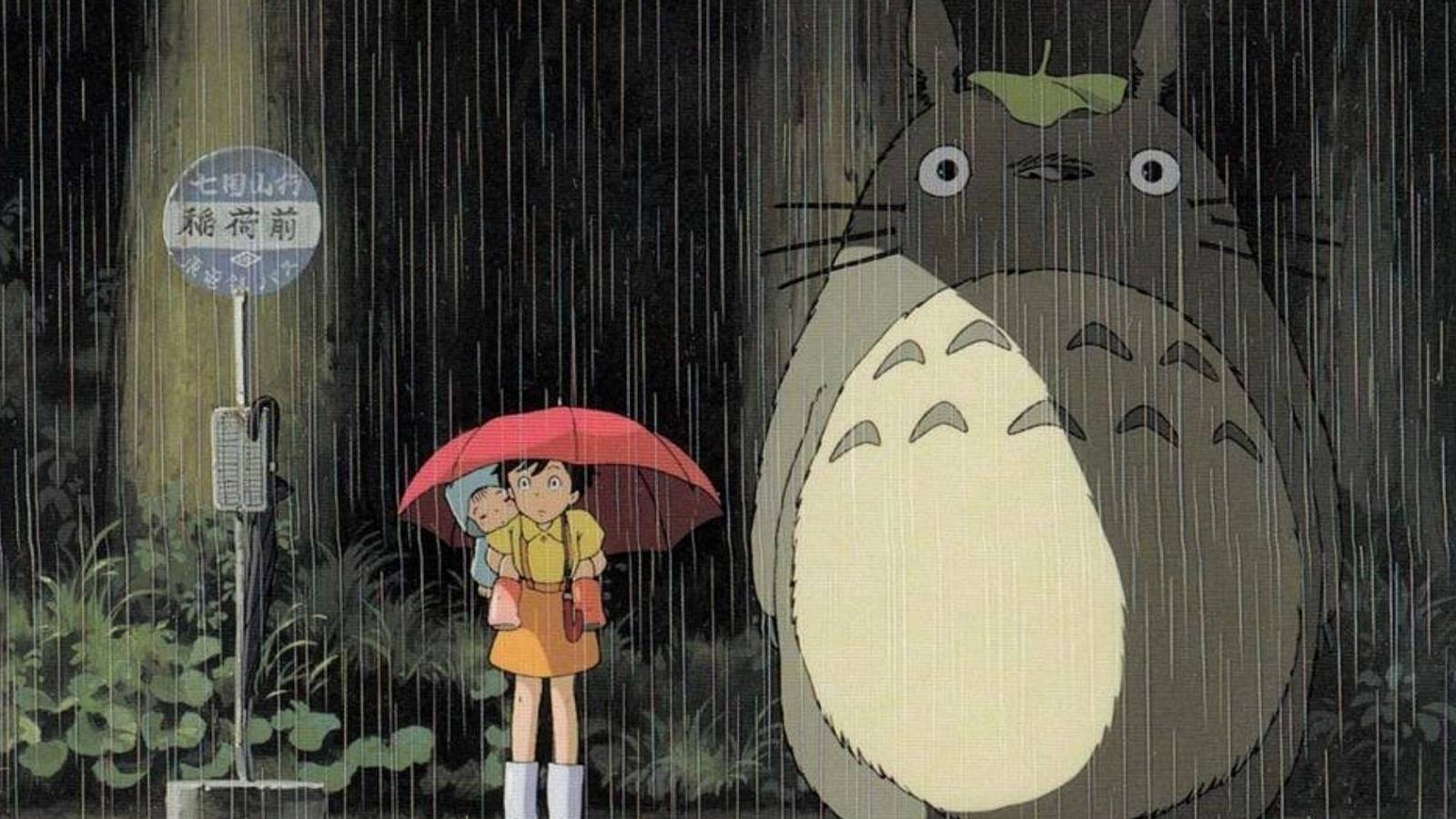 Satsuki, Mei, and Totoro waiting at the bus stop in My Neighbor Totoro