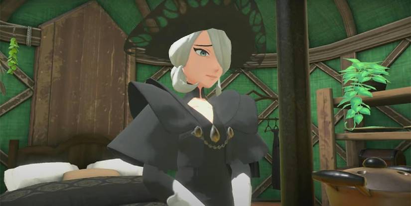 Cogita sitting and smiling in her tent in Pokemon Legends Arceus