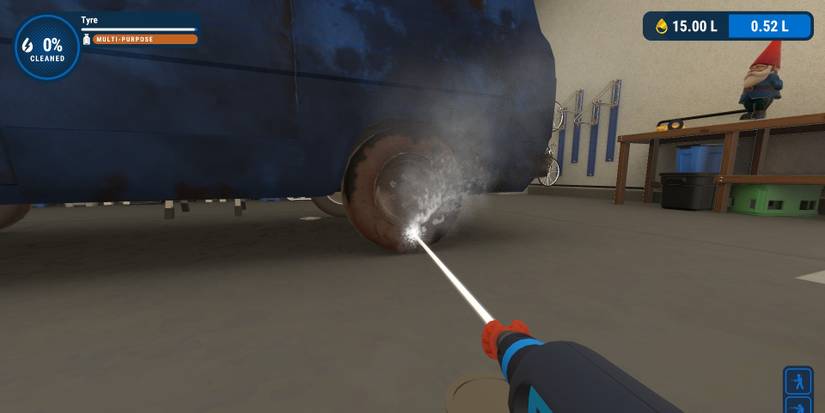 A power washer with a red nozzle shooting strongly at a wheel of a dirty van in PowerWash Simulator