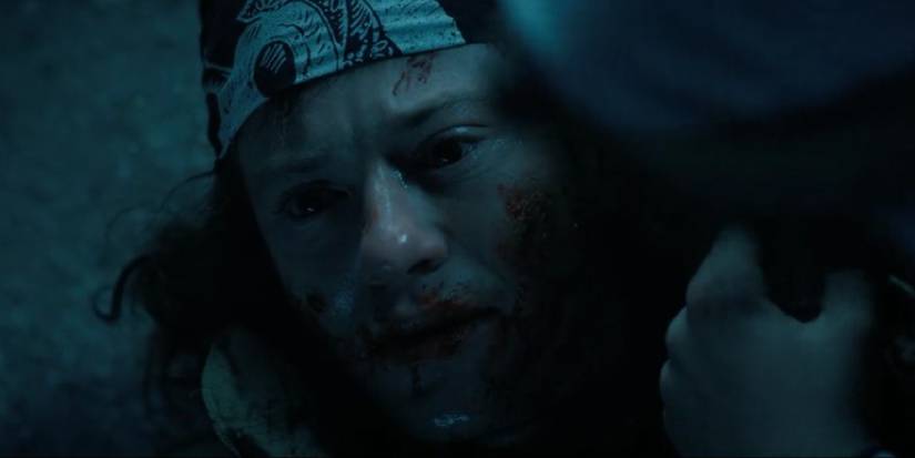 Eddie dying in Dustin's arms in the Upside-Down in Episode 9