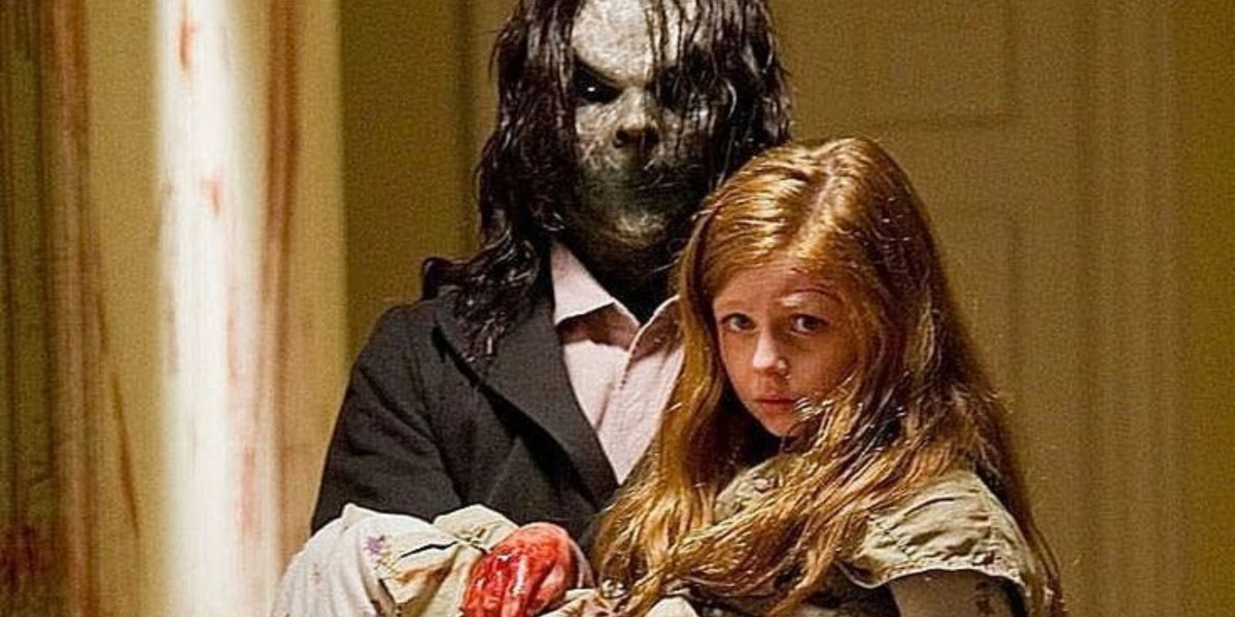Bughuul holding Ashley (Claire Foley) in Sinister