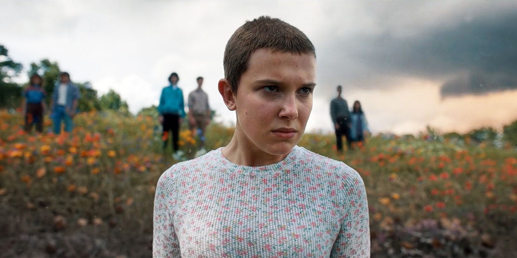 Eleven (Millie Bobby Brown) standing in a field in the season 4 Stranger Things finale