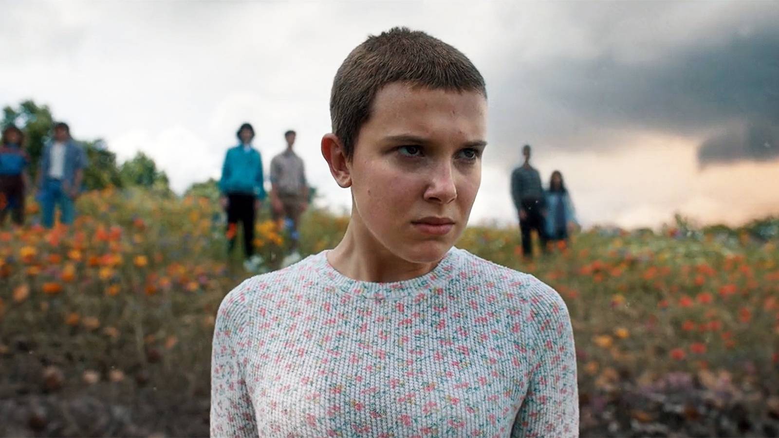 Eleven (Millie Bobby Brown) standing in a field in the season 4 Stranger Things finale