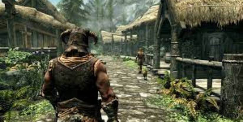 Dovahkiin walkingn in a village in The Elder Scrolls V Skyrim
