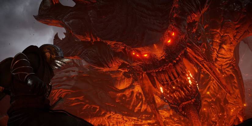 A screenshot showing the Dragon God boss from Demon's Souls (2020).