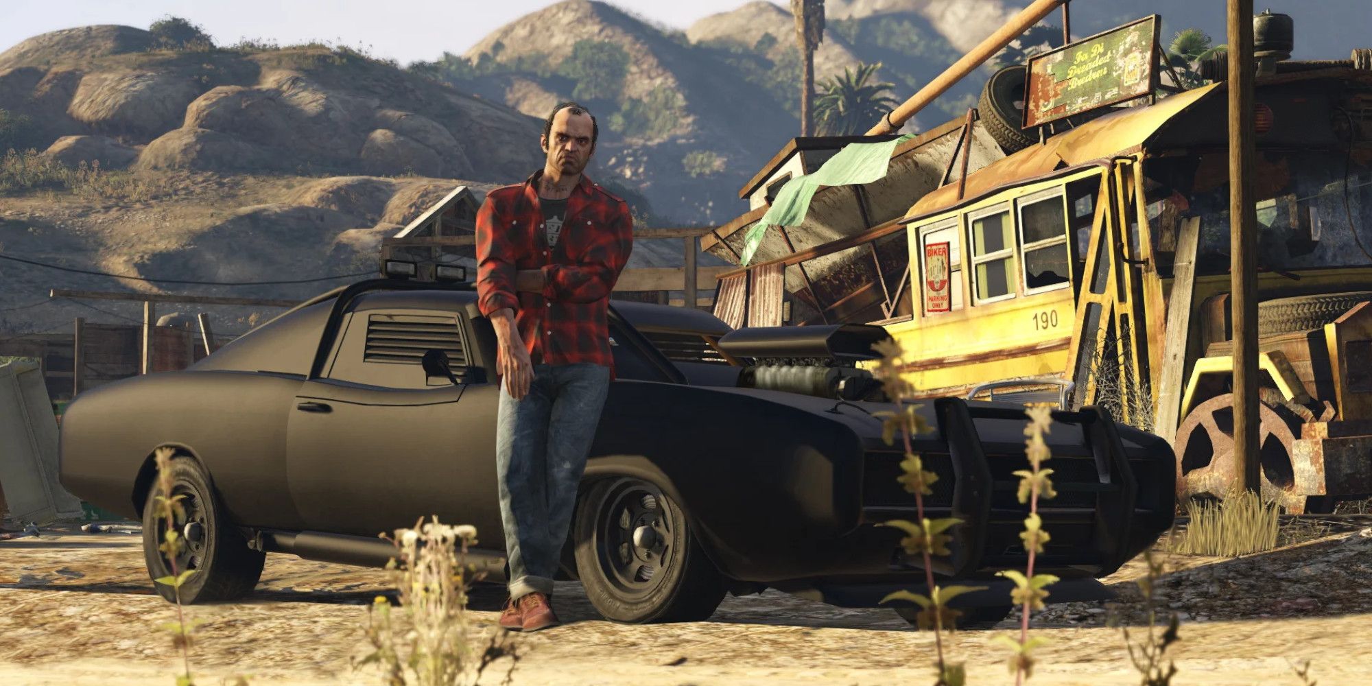 A GTA V character leans against an armored muscle car