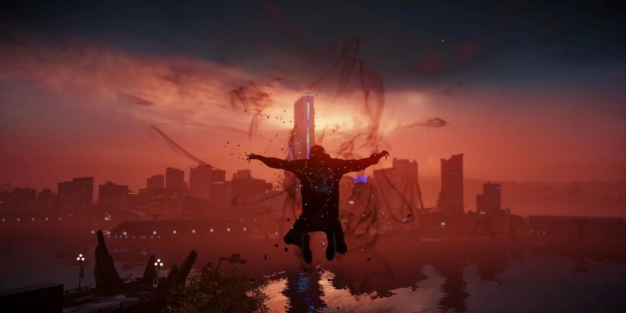 Delsin Rowe leaps in the air in front of a city skyline