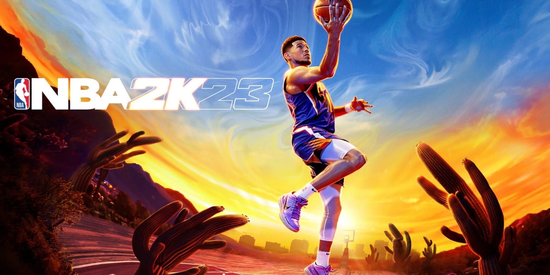 nba 2k23 cover athlete devin booker shooting a layup in the desert