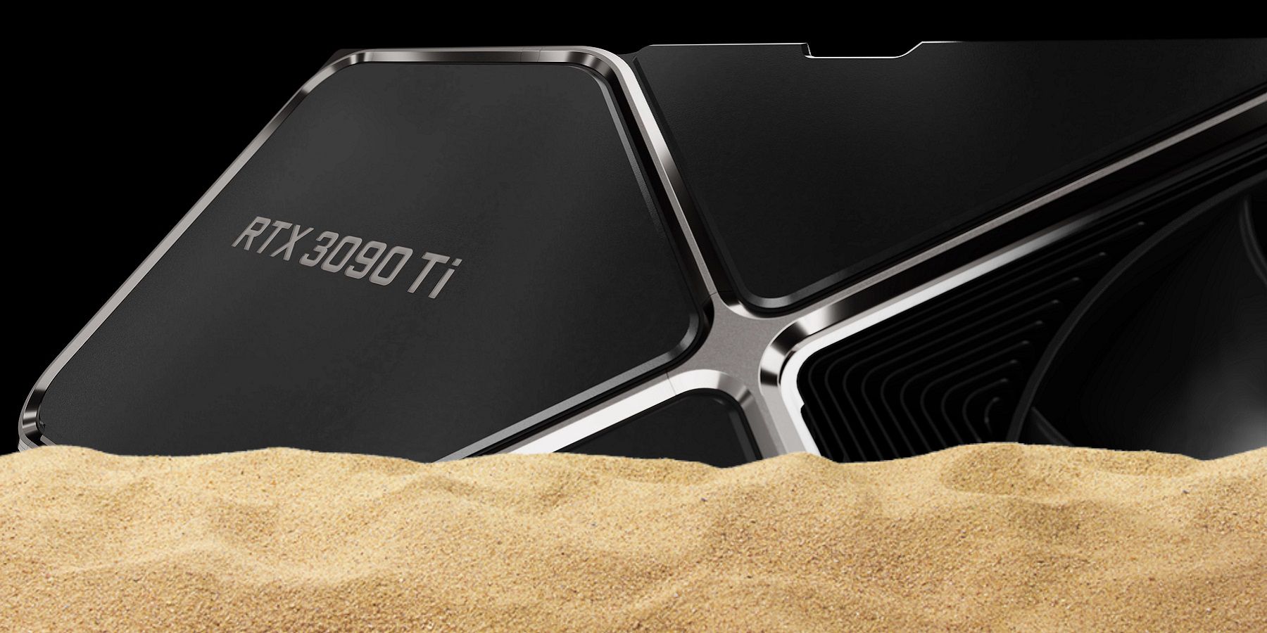 Close-up image of an Nvidia RTX 3090 Ti graphics card with some sand in front of it.