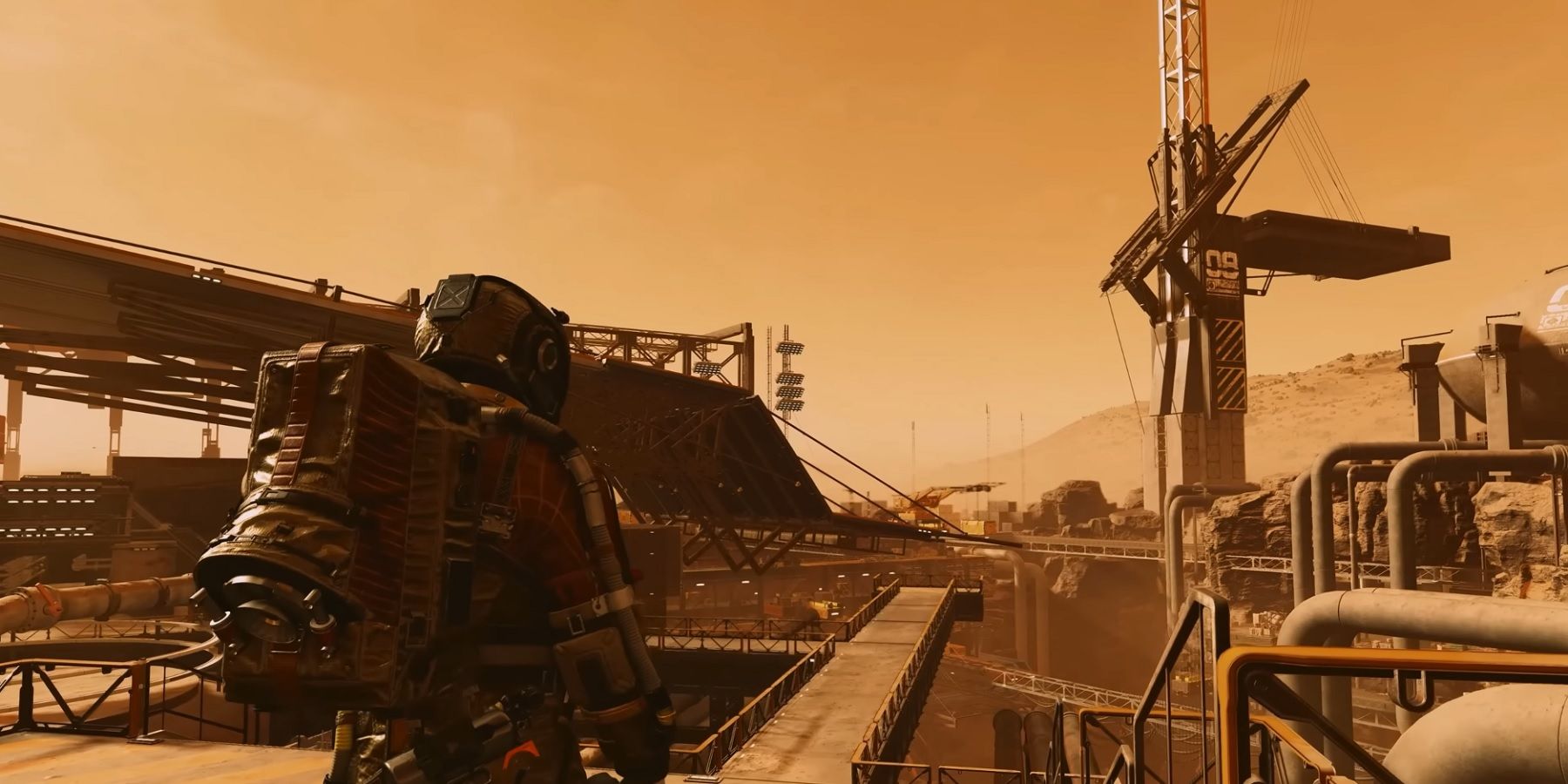 Image from Starfield showing an astronaut and an industrial zone all bathed in orange.