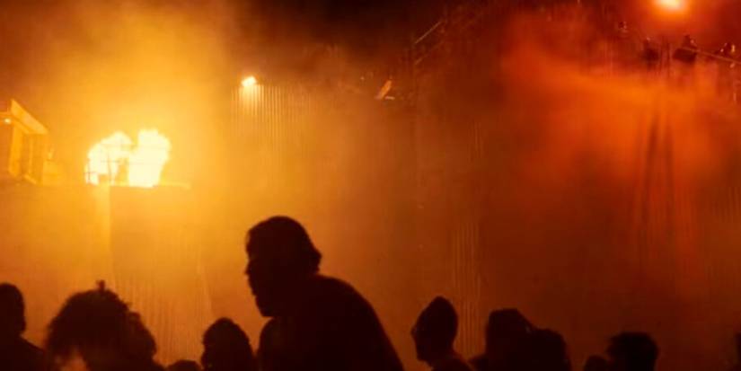 A Group Of Zeros in Netflix's Resident Evil Series With Umbrella Soldiers Watching From Above