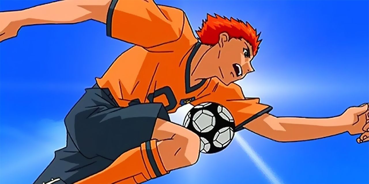 A player from Hungry Heart Wild Striker Running With The Ball