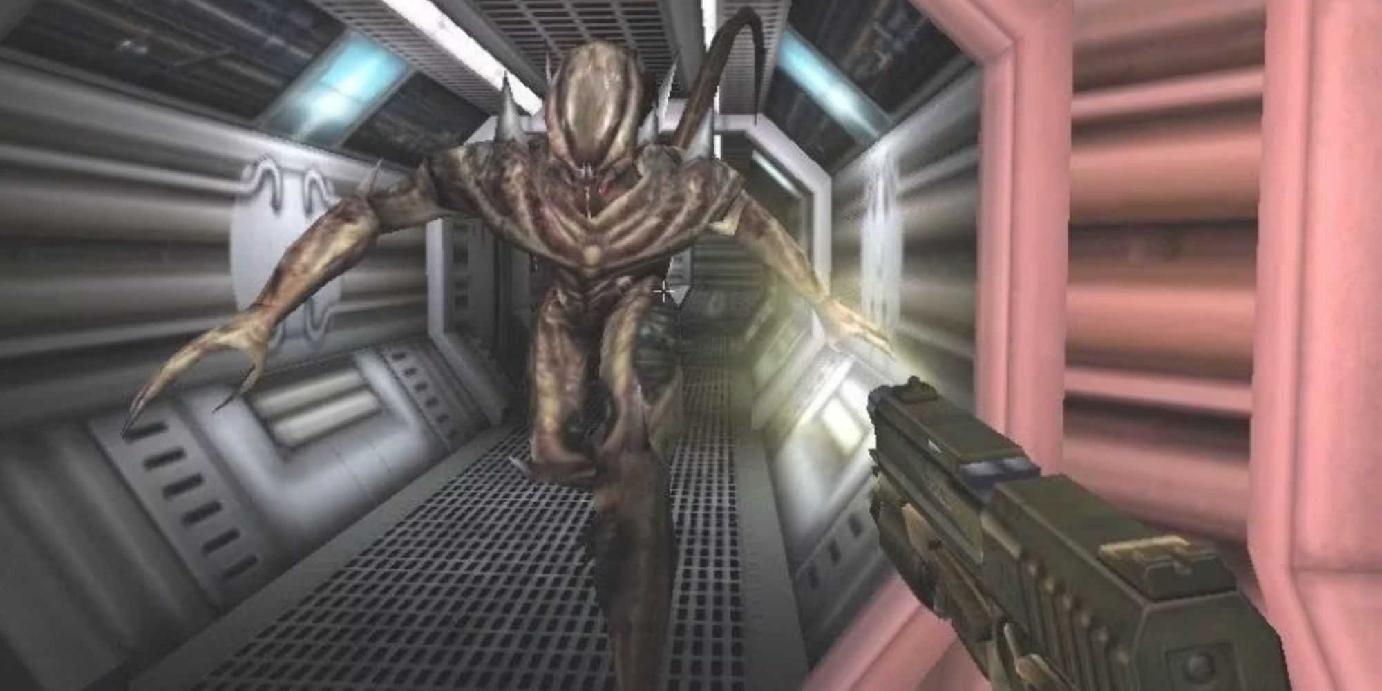 A Xenomorph runs down a hallway while a marine fires at it in Aliens Versus Predator