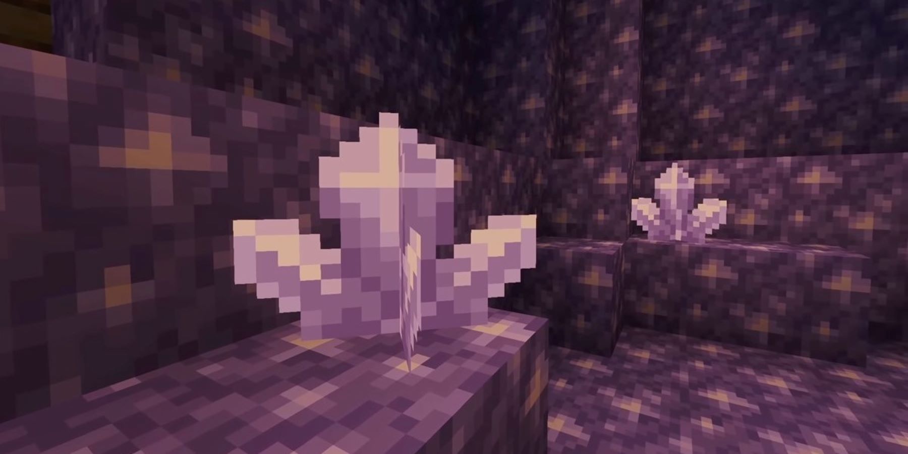 Close-up of two amethyst crystals inside a Minecraft geode