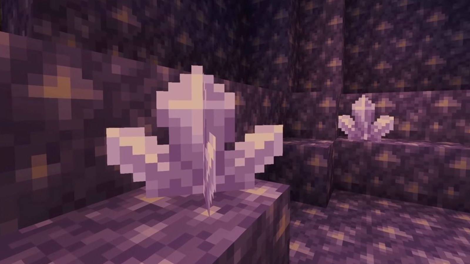 Close-up of two amethyst crystals inside a Minecraft geode