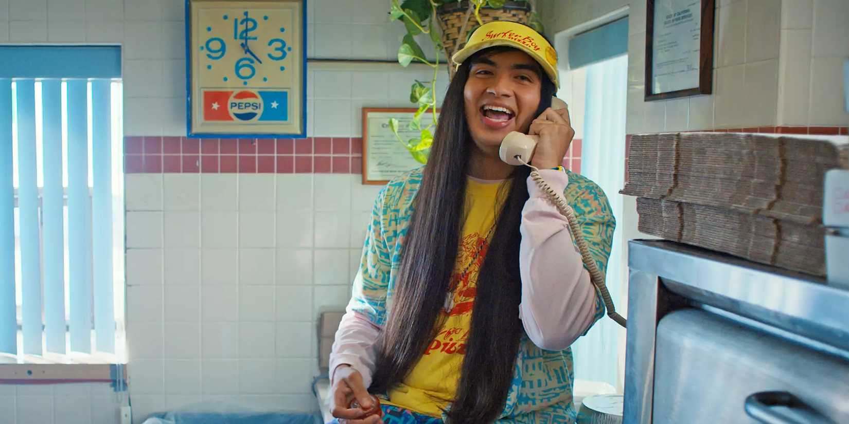 Argyle from Stranger Things laughing and talking on the phone