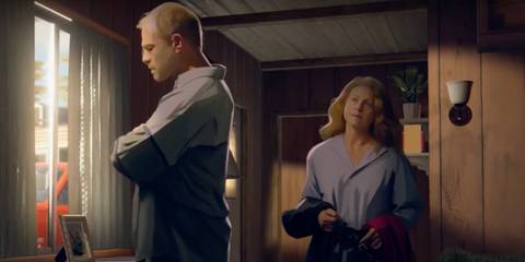 Paul crosses his arms while Sharon looks at him from behind in As Dusk Falls