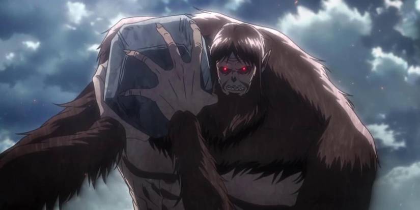 The Beast Titan angrily lifting a boulder in Attack on Titan