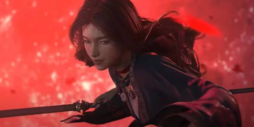 Woman in front of red moon.