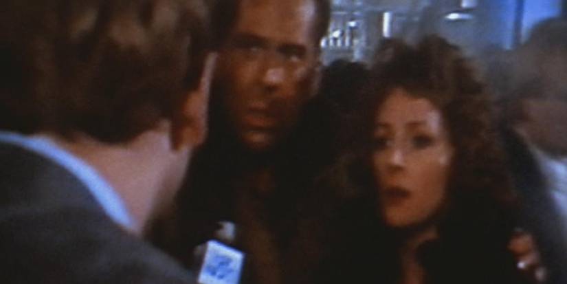 Holly Gennaro and John McClane hounded by a reporter in Die Hard