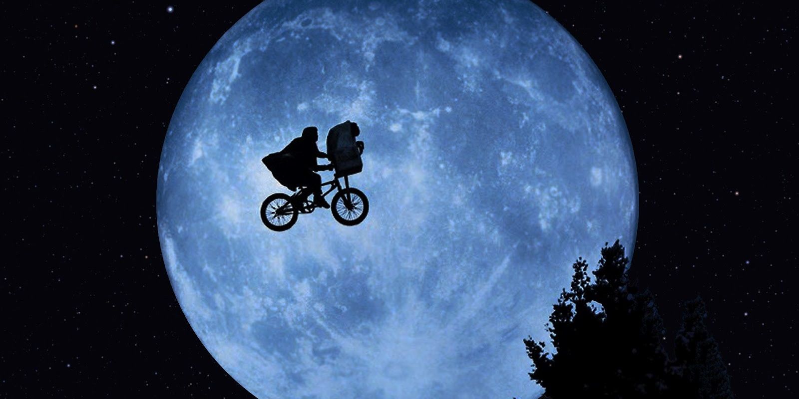 Elliott and ET fly past the moon in ET the Extra-Terrestrial