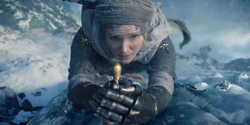 Morfydd Clark as Galadriel hanging from cliff in Lord of the Rings: Rings of Power