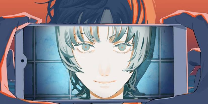 A young girl with light blue hair, seen through a smartphone camera