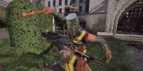 A Chivalry 2 player watching an opponent swing a recorder at the Courtyard.