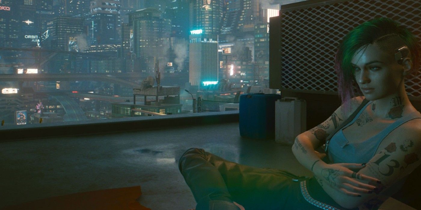 Judy Alvarez Cyberpunk 2077 kicking back on rooftop with Night City skyline