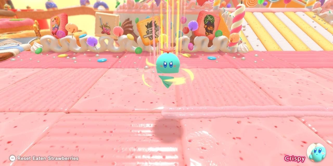 Скриншот: Кирби в образе морковного бура, врезающегося в торт в Kirby