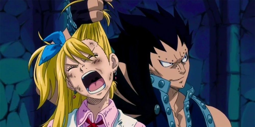 Image of Gajeel grabbing Lucy by the hair in the Fairy Tail anime