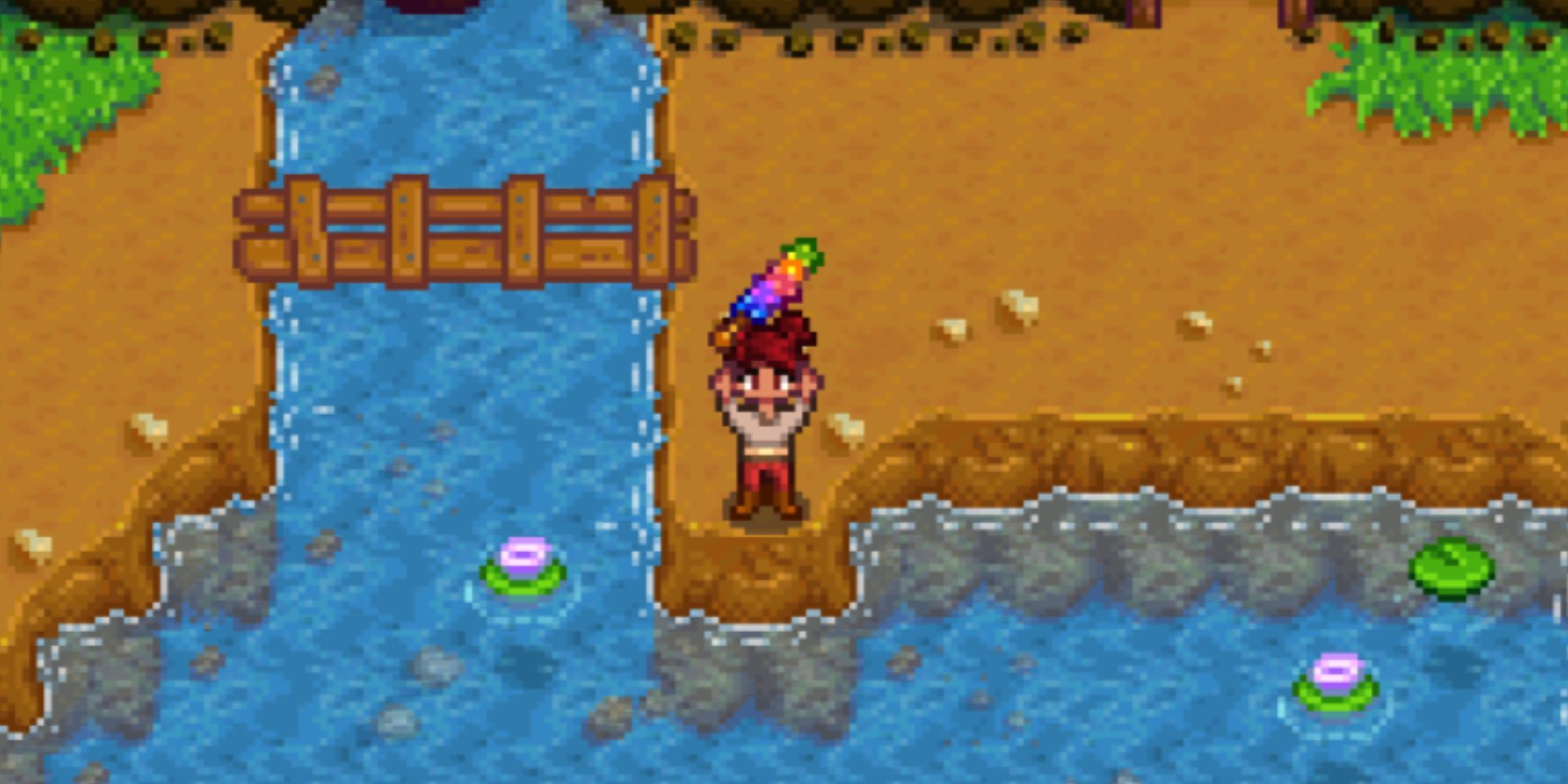 Player holding a Magic Rock Candy in Stardew Valley outside the mines in Pelican Town