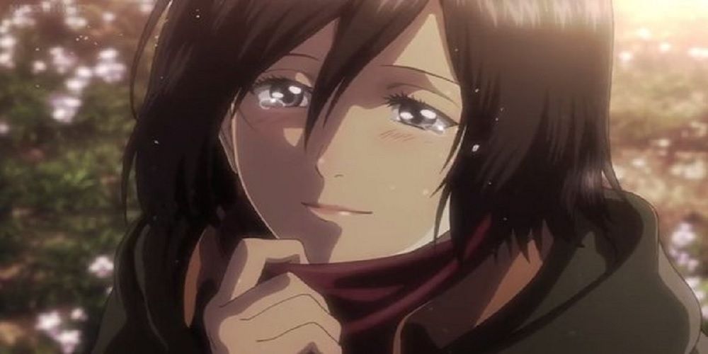 Mikasa tearfully smiling in Attack on Titan