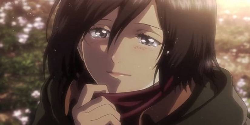 Mikasa tearfully smiling in Attack on Titan