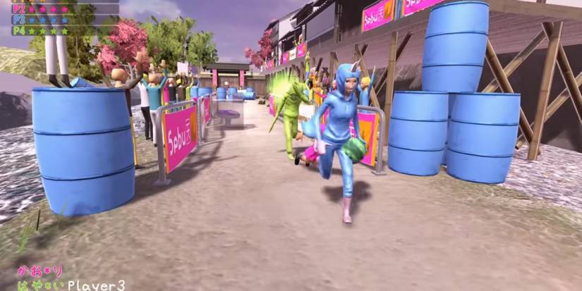 Three players taking part in Nippon Marathon running through the streets surrounded by an audience and blue barrels