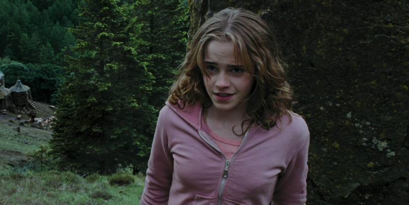 Hermione smiling after punching Draco in Prisoner of Azkaban